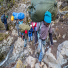 Balancing Comfort and Conservation: How Many Porters Should Climb Kilimanjaro per One Climber?